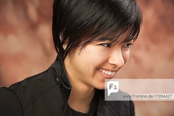 Smiling attractive ethnic girl portrait on muslin background