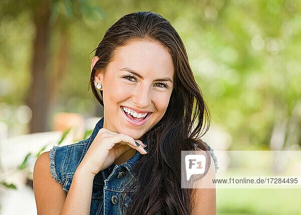 Attractive mixed-race girl portrait outdoors