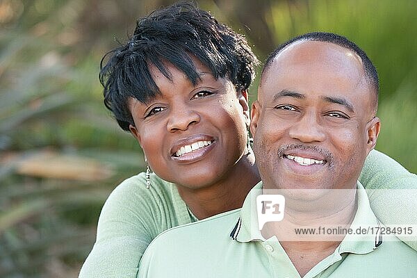 Attractive and affectionate african american couple posing in the park