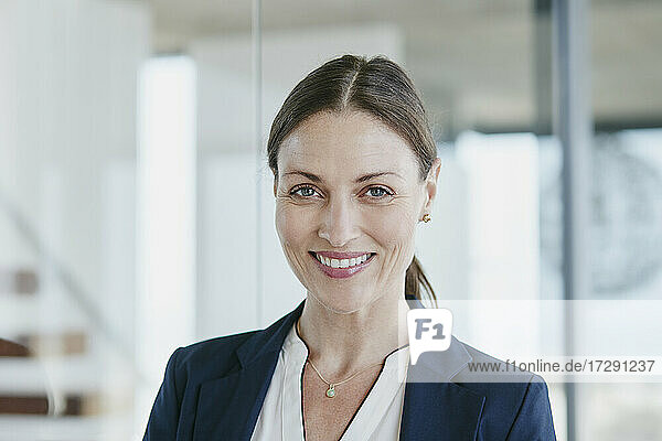 Beautiful saleswoman with brown hair smiling
