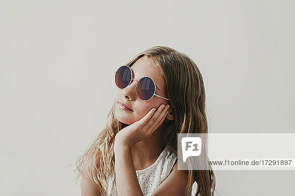 Girl wearing sunglasses looking away