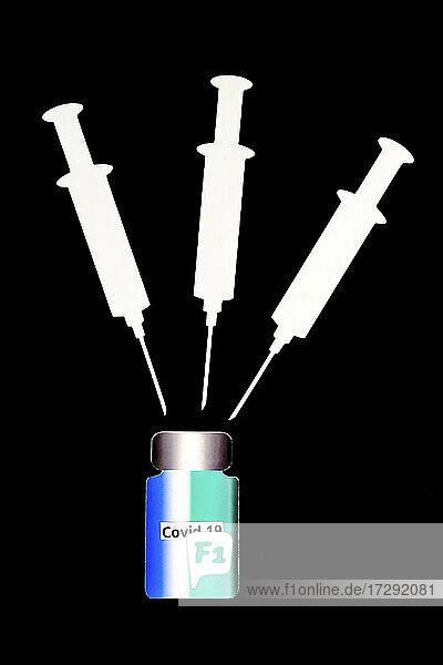 2D paper cutouts of blank syringes and bottle of vaccine