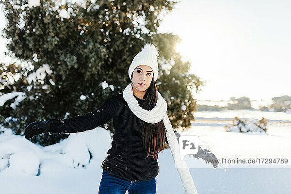 Beautiful woman standing on snow