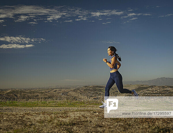 Woman jogging in landscape