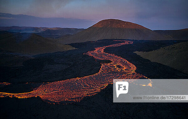 Flowing lava in volcanic mountains