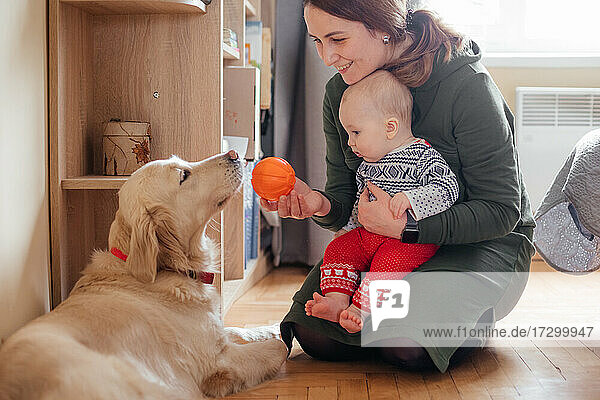 Family moments with dog and newborn baby