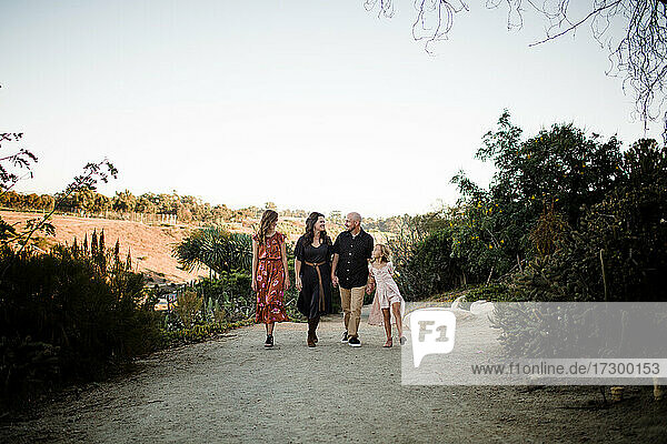 Family of Four Walking in Desert Garden in San Diego