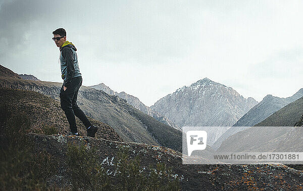 young man walking in the mountains