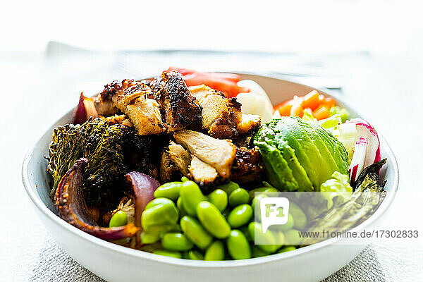 Roasted chicken  broccoli  edamame  avocado salad bowl for lunch