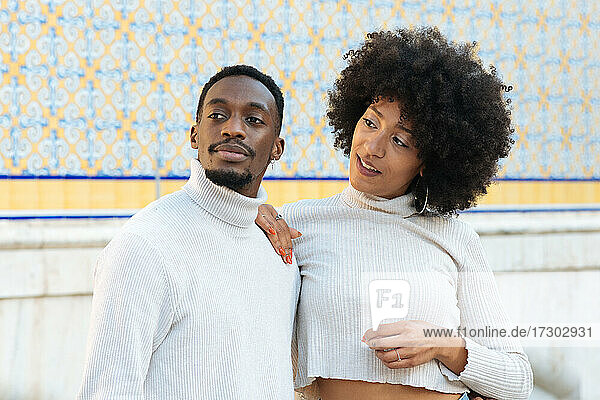 Black couple in a smart pose at Valencia Market