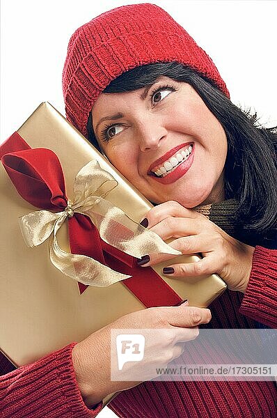 Attractive woman holds holiday gift isolated on a white background