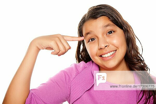 Pretty hispanic girl pointing to her head portrait isolated on a white background