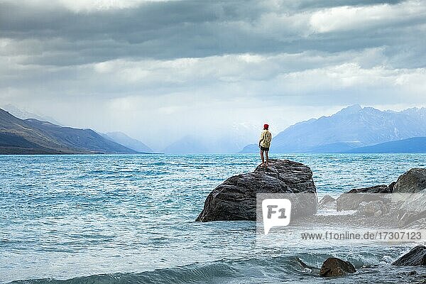 Guy at a beach at Lake Tekapo  Lake Tekapo  Canterbury region  Mackenzie District  South Island  New Zealand  Oceania
