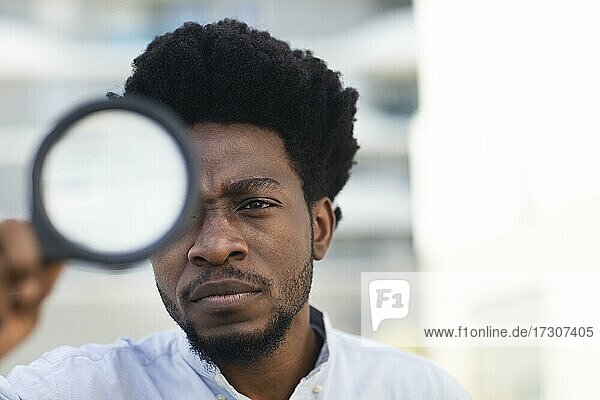 Young black man with afro look is looking for a vision  Freiburg  Baden-Württemberg  Germany  Europe