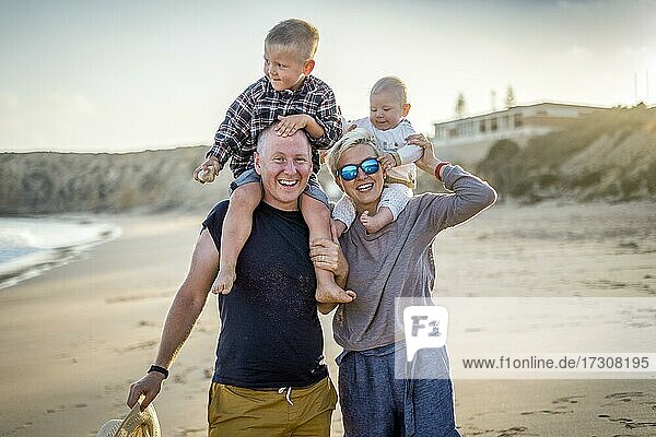 The family with two small boys enjoying the beach  Algarve  Portugal  Europe