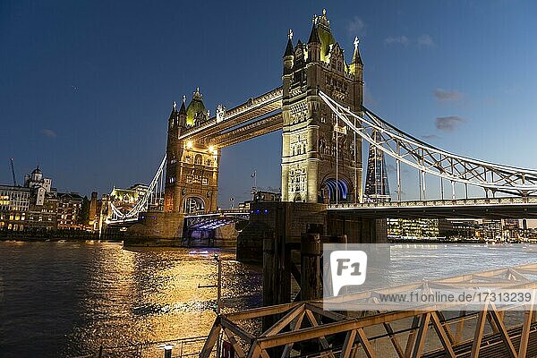 Illuminated Tower Bridge over the Thames in the evening  London  England  United Kingdom  Europe