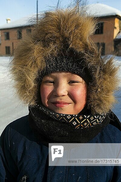 Friendly young local boy  Artyk village  Road of Bones  Sakha Republic  Yakutia  Russia  Europe