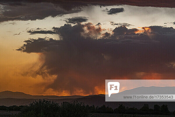 Usa  Idaho  Bellevue  Storm clouds over landscape at sunset