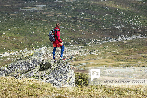 Australia  New South Wales  Man standing on rock at Charlotte Pass in Kosciuszko National Park