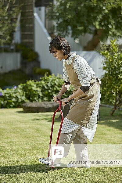 Japanese woman working in the garden