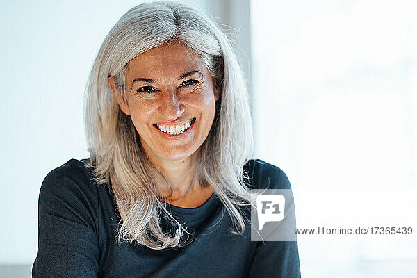 Smiling mature businesswoman at office