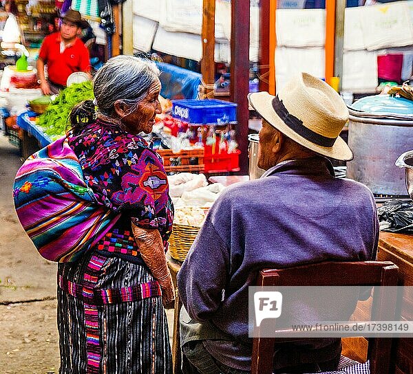 Chat at the market  most important market in the highlands  Chichicastenango  Chichicastenango  Guatemala  Central America