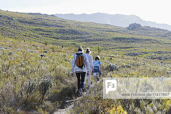 Family hiking a nature trail  Phillipskop nature reserve  Stanford  South Africa.