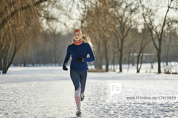 Woman jogging during winter