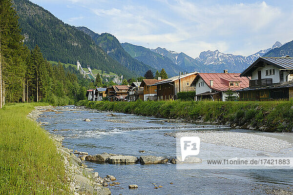 Germany  Bavaria  Oberstdorf  Trettach river flowing past mountain town in summer