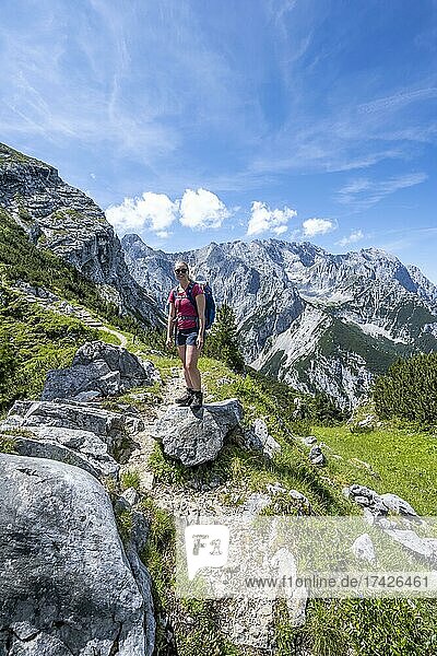 Hiker on the trail to the Meilerhütte  Wetterstein Mountains  Garmisch-Partenkirchen  Bavaria  Germany  Europe