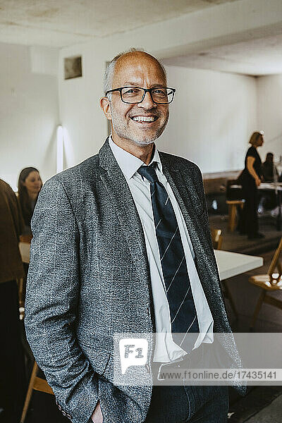 Portrait of smiling male board of director in office