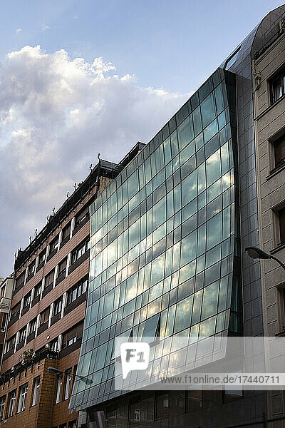 Spain  Biscay  Bilbao  Clouds reflecting in glass facade