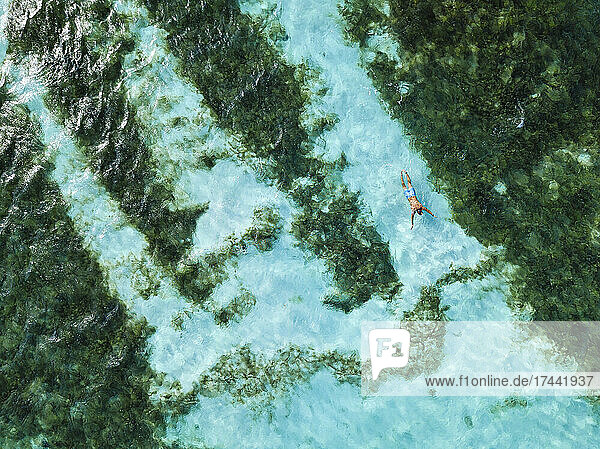 Mid adult man swimming in ocean at Huraa island  Maldives
