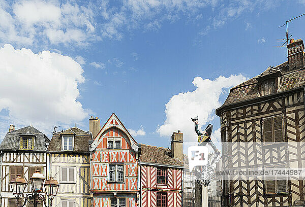 France  Yonne Department  Auxerre  Cadet Rousselle statue in front of historic half-timbered houses