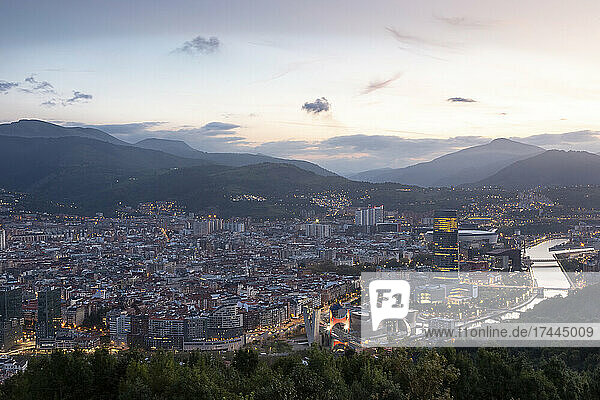 Spain  Biscay  Bilbao  Riverside city at dusk