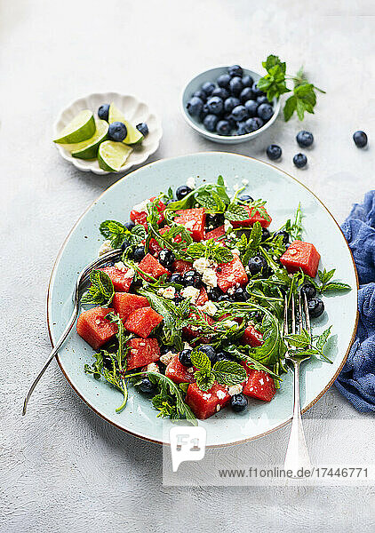 Fresh rocket salad with watermelon  blueberries and feta cheese