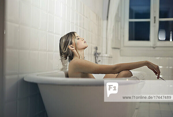 beautiful woman relaxat in bathtub