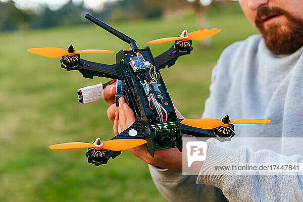 Man holding a racing drone. FPV high-speed racing drone