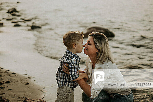 mom and son hugging on the seaside