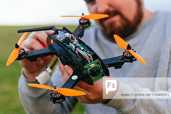 Man holding a racing drone. FPV high-speed racing drone.