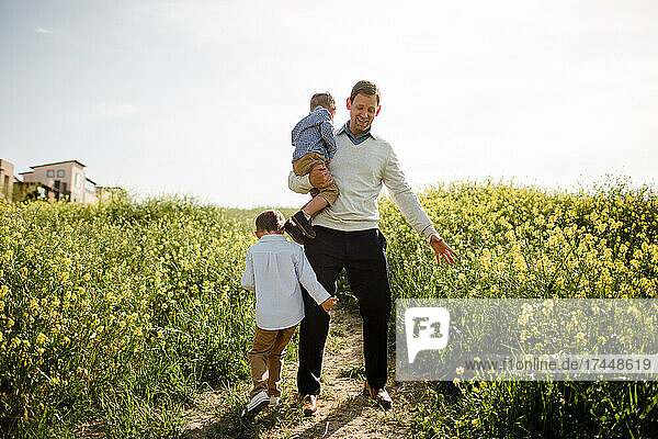 Dad & Sons Playing in Wildflower Field in San Diego