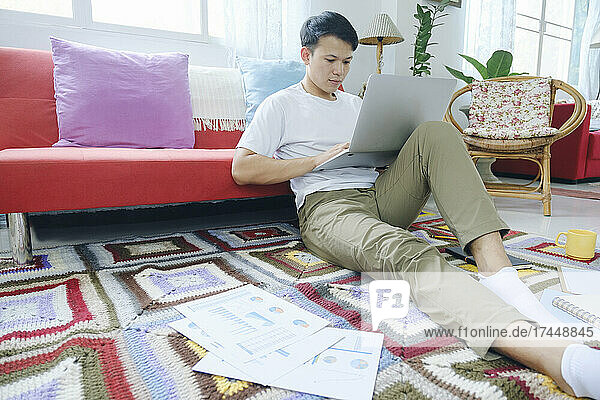 Young man online working and learning from home