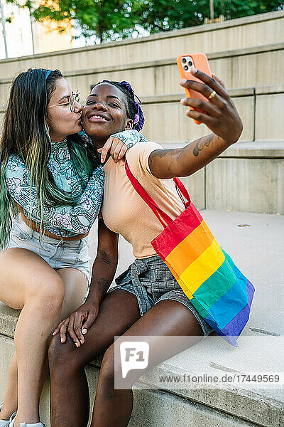 multiracial lesbian couple making a selfie
