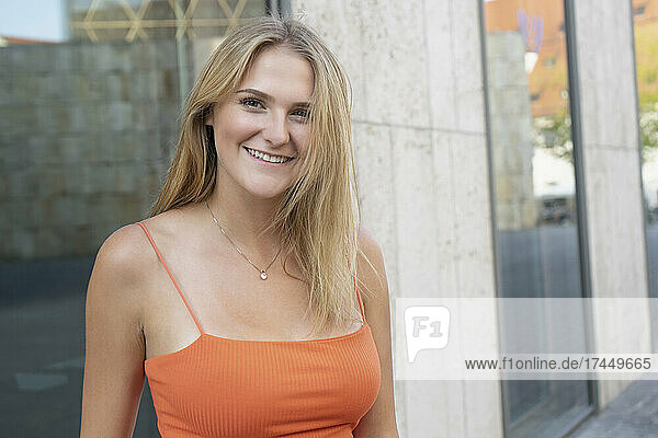 Portrait of woman smiling into camera in Munich
