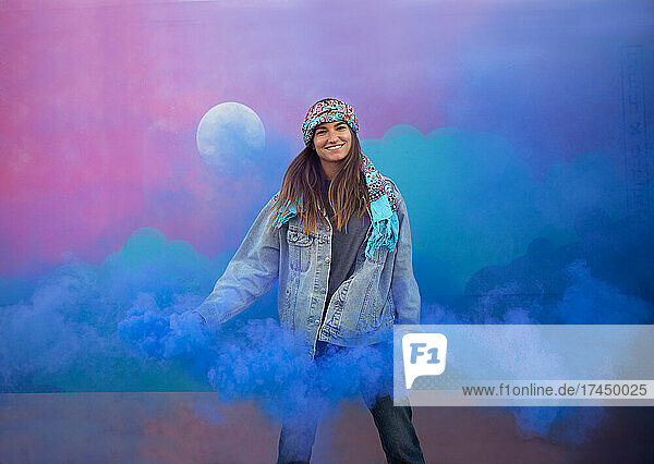 Happy Fun Girl With Smoke Bomb In Front Of Street Art