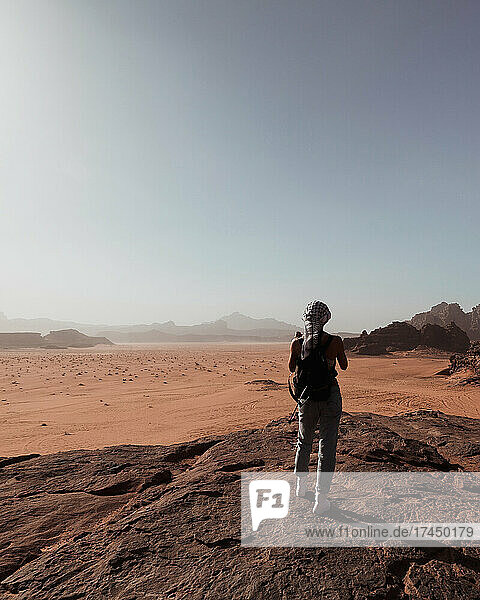 Girl looking at desert in Wadi Rum