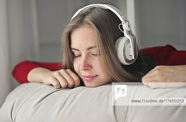 portrait of a young woman listening to music