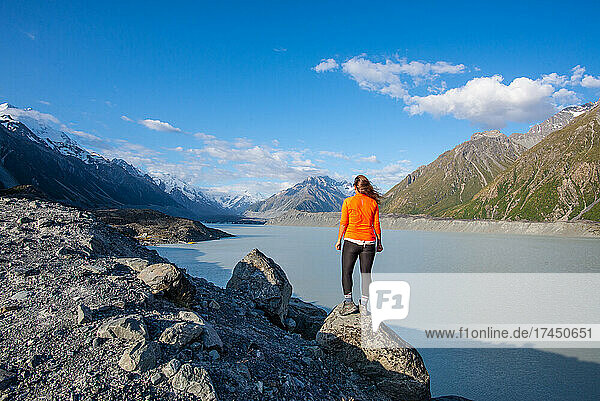 Girl Looks Out Over Mountains & Lake In Aorki Mount Cook New Zealand