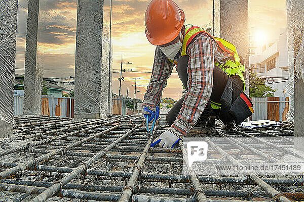 Construction Worker Builder checking his buildings or foundation