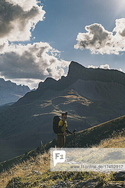 Man with a backpack hiking the mountains  Pyrenees  Spain